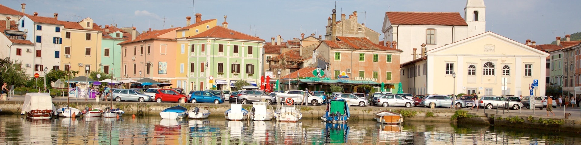 Izola Marina featuring a small town or village and a bay or harbor