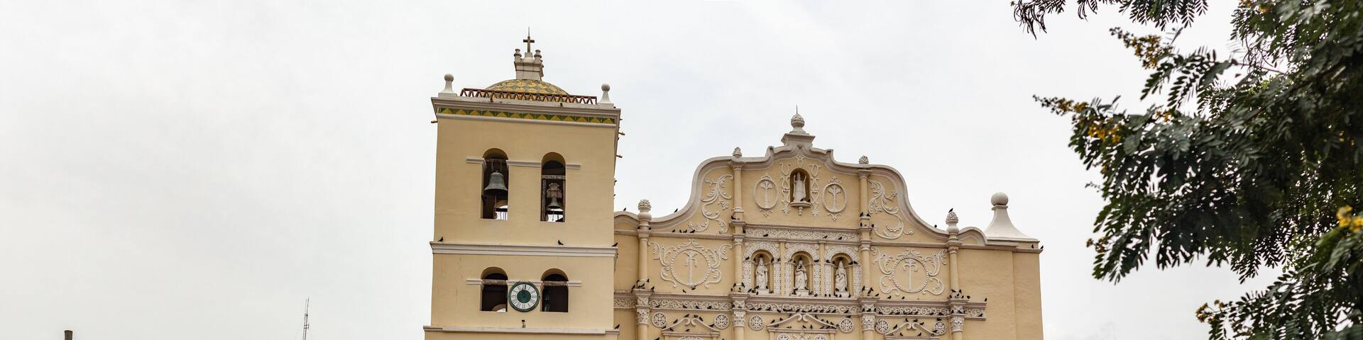 Few tourists taking photos of the Immaculate Conception Cathedral in Honduras