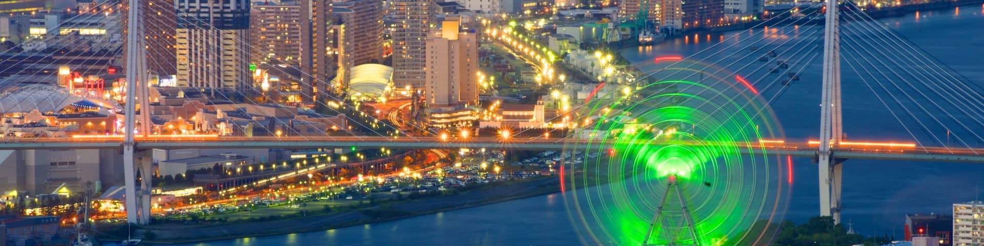 Osaka Prefectural Government Sakishima Building showing a river or creek, night scenes and a city