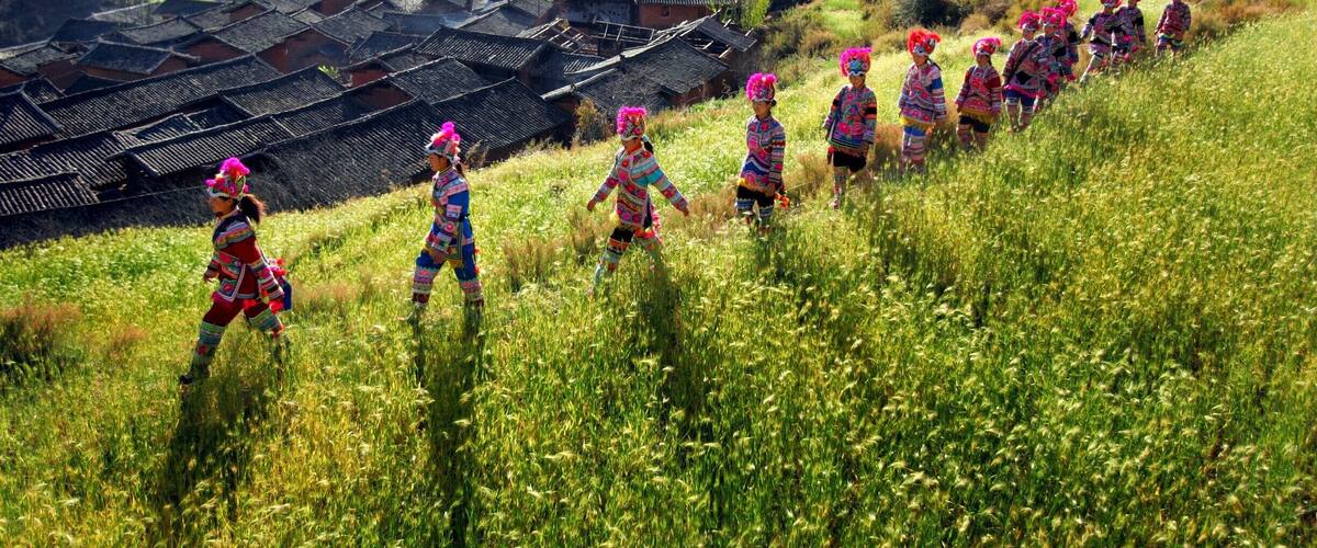 A village with traditional architecture and terraced fields.