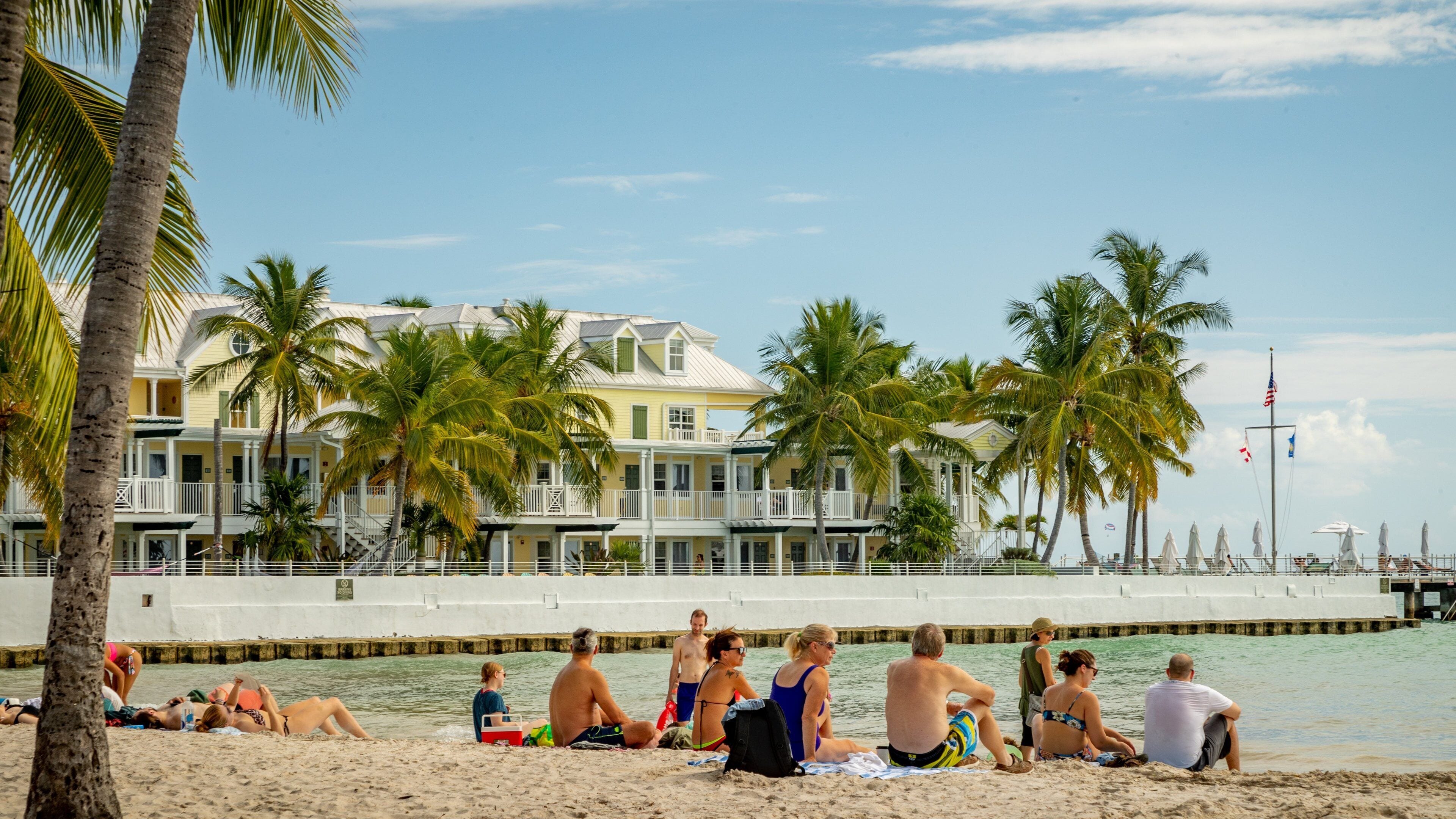 South Beach featuring a sandy beach and general coastal views as well as a small group of people