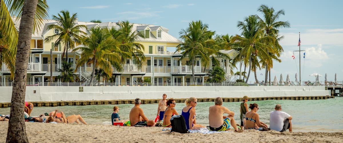 South Beach featuring a sandy beach and general coastal views as well as a small group of people