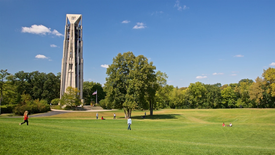 Moser Tower and Millennium Carillon showing a garden as well as a small group of people
