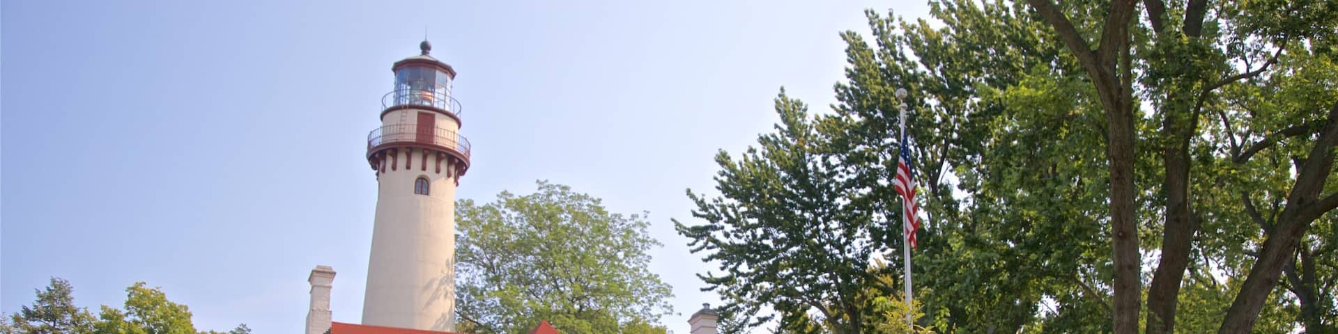 Grosse Point Lighthouse featuring a lighthouse and a house