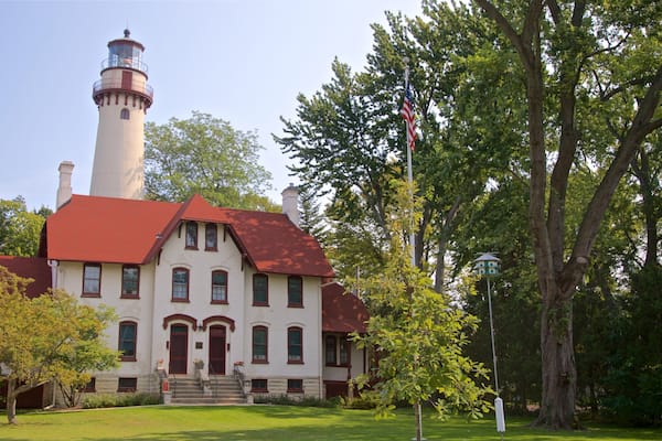 Grosse Point Lighthouse featuring a lighthouse and a house