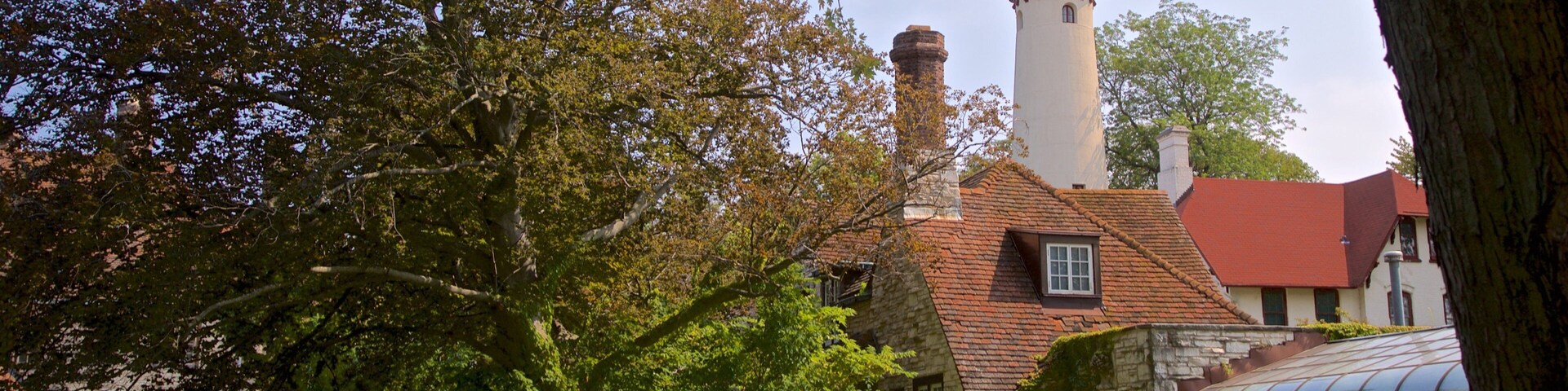 Grosse Point Lighthouse featuring a lighthouse and a park