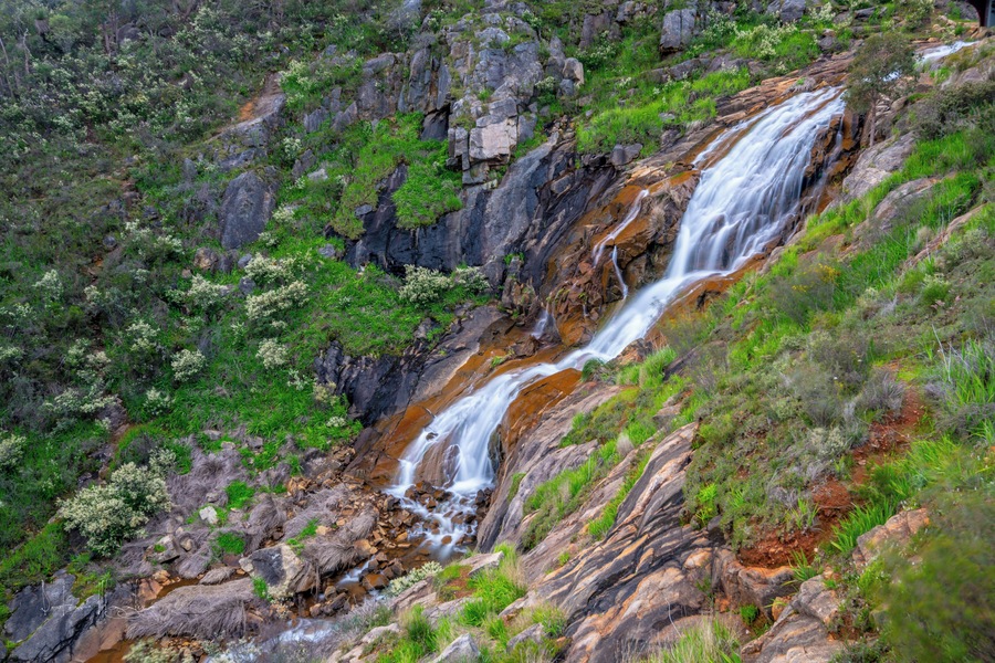 It was a rather dull early spring day. I missed the heavy rain that fell last week. The brook feeding this fall was quite unphotogenic with metres of vegetation on either side flattend by recent turbulant waters.
Like most waterfalls, these falls are at there very best after the heavy rains in Winter