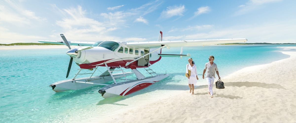 Exuma showing aircraft, a beach and tropical scenes