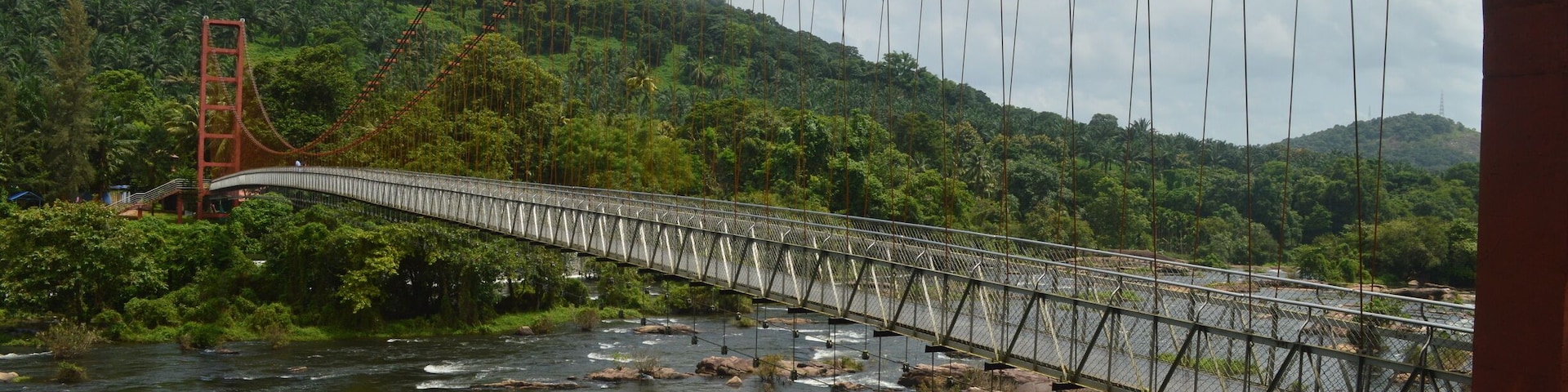 If you are going to visit Kerala, athirapilly is a must visit. Kerala is known as God's own country for a reason and places like these just proves it. This photograph is of a hanging bridge.