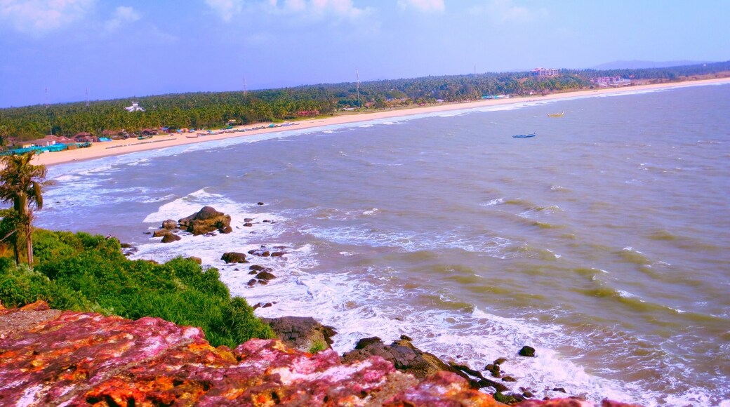 View of the lovely coastline from the Bekal Fort. The waves hit the rocky patches on the beach splashing water on the Fort walls. The sea looks calm now.