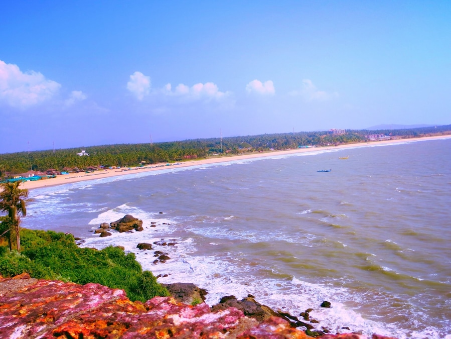 View of the lovely coastline from the Bekal Fort. The waves hit the rocky patches on the beach splashing water on the Fort walls. The sea looks calm now.