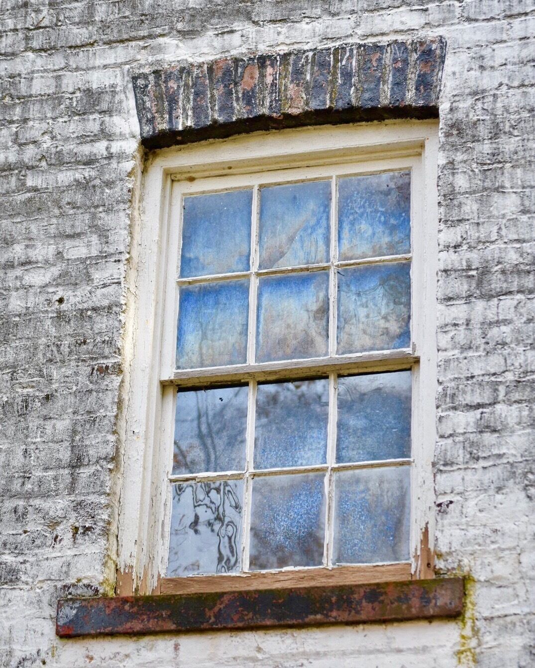 I love the way the old wavy windows of the Enameling Building reflect with iridescence 