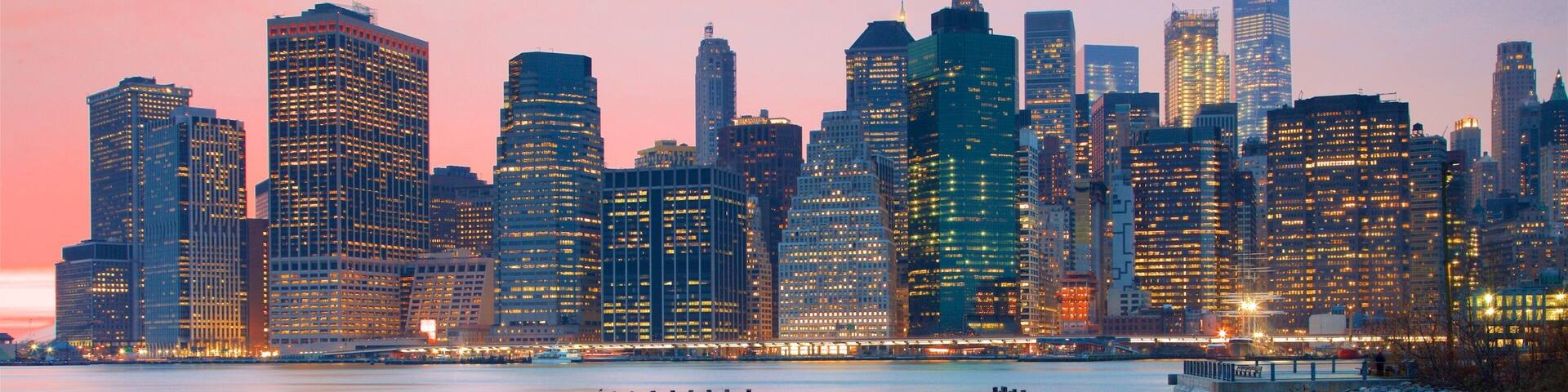 Brooklyn Bridge Park which includes a sunset, a river or creek and a skyscraper