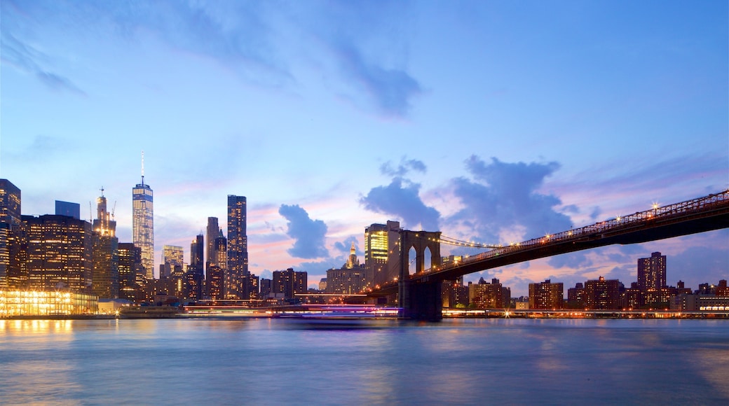 Brooklyn Heights Promenade featuring a skyscraper, a river or creek and a bridge