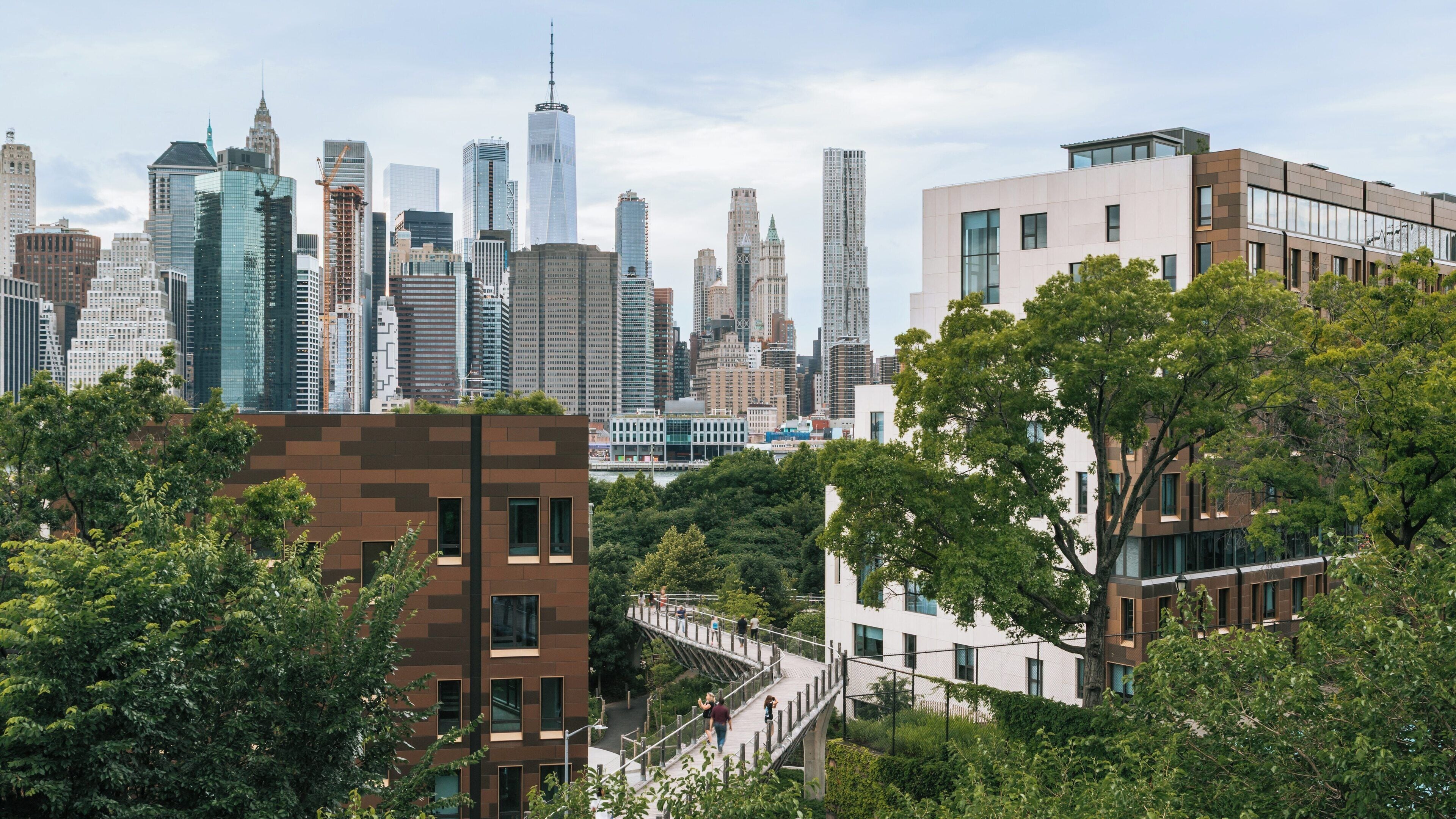 Brooklyn Heights Promenade offers stunning views of Manhattan skyline surrounded by greenery in Brooklyn, New York