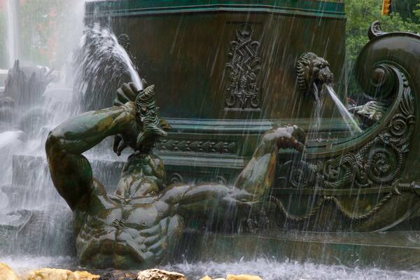 Grand Army Plaza featuring a statue or sculpture and a fountain