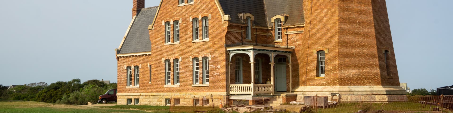 Block Island, RI / United States - Sept. 15, 2020: A landscape view of Block Island Southeast Light, a lighthouse located on Mohegan Bluffs, designated a U.S. National Historic Landmark in 1997.