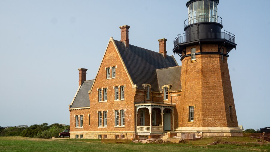 Block Island, RI / United States - Sept. 15, 2020: A landscape view of Block Island Southeast Light, a lighthouse located on Mohegan Bluffs, designated a U.S. National Historic Landmark in 1997.
