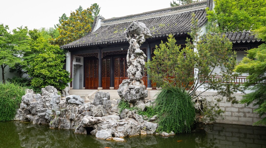 New York Chinese Scholar\'s Garden showing a pond, heritage elements and a garden