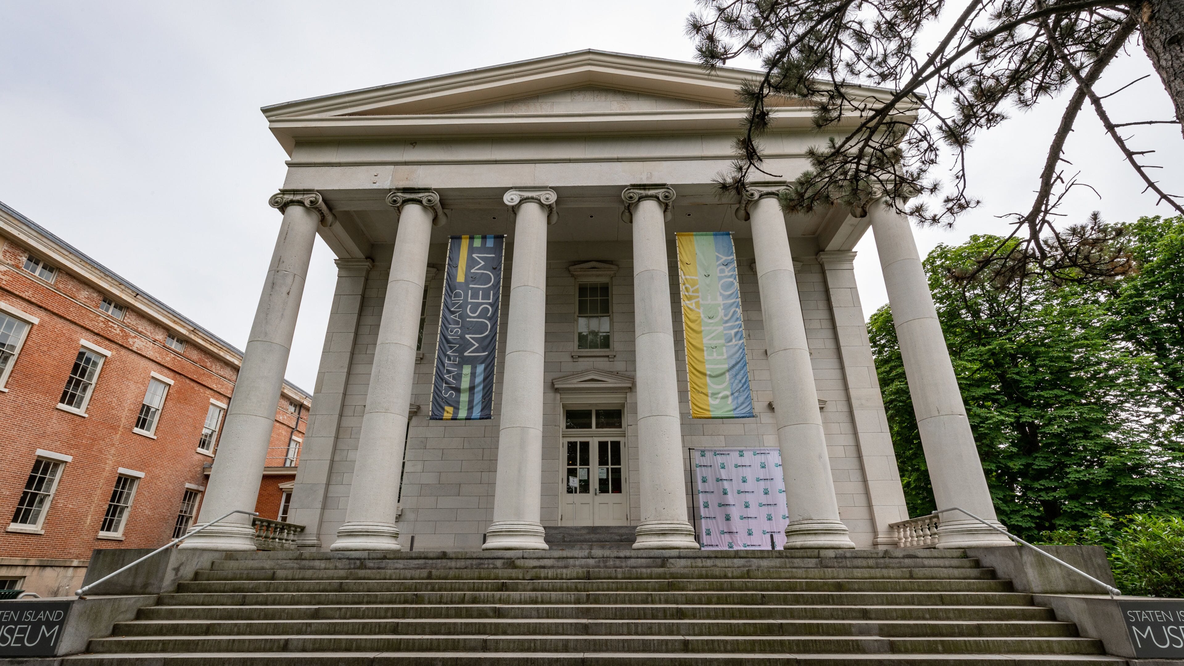 Staten Island Museum featuring signage and heritage architecture