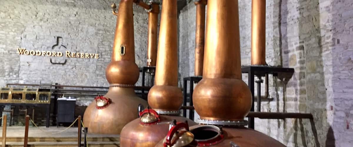 The triple
Copper distillation stills at Woodford Reserve. They are the only distillery to use three stills in the process of making bourbon.