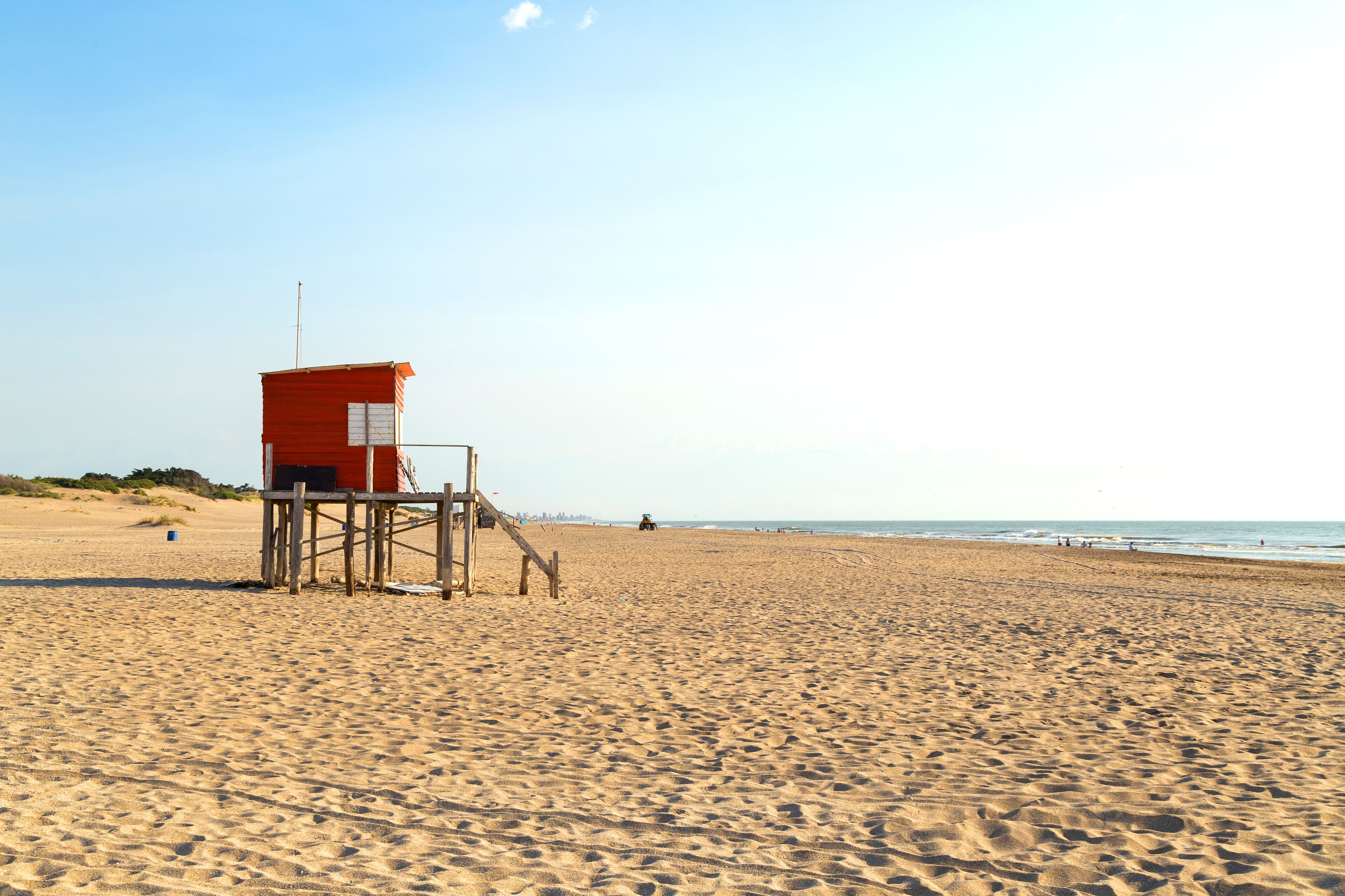 Beach scene. Beautiful morning of summer. The sun bright over the sea. Mar de las Pampas. Argentina.