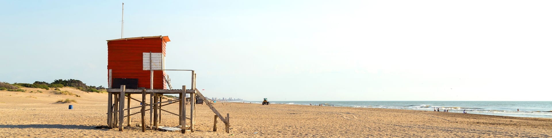 Beach scene. Beautiful morning of summer. The sun bright over the sea. Mar de las Pampas. Argentina.