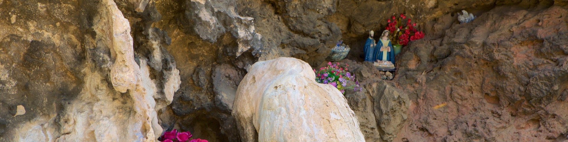 Lourdes Grotto which includes caves and religious elements