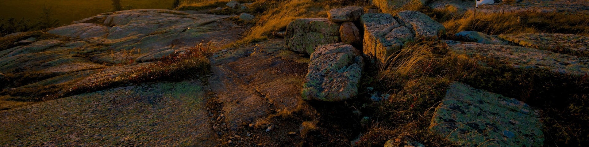 Cadillac Mountain which includes a sunset, landscape views and mountains