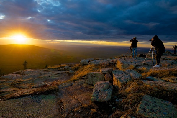 Cadillac Mountain which includes a sunset, landscape views and mountains