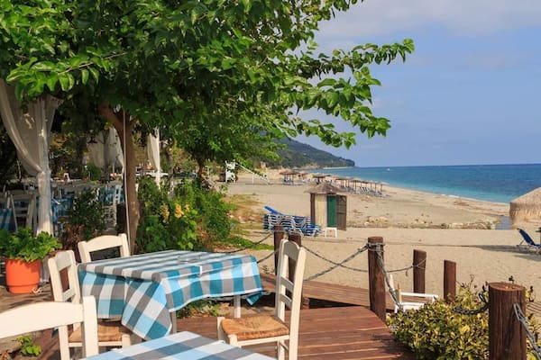 Chorefto beach on Pelion-where the mountains meet the sea.Check the numerous beaches on the Pelion peninsula, have a luch of spetzofai (dish with local sausage) in a mountain tavern with a view under an ancient chinar tree or have a strol in the nearby Volos city and see the replica of the Agronauts ship