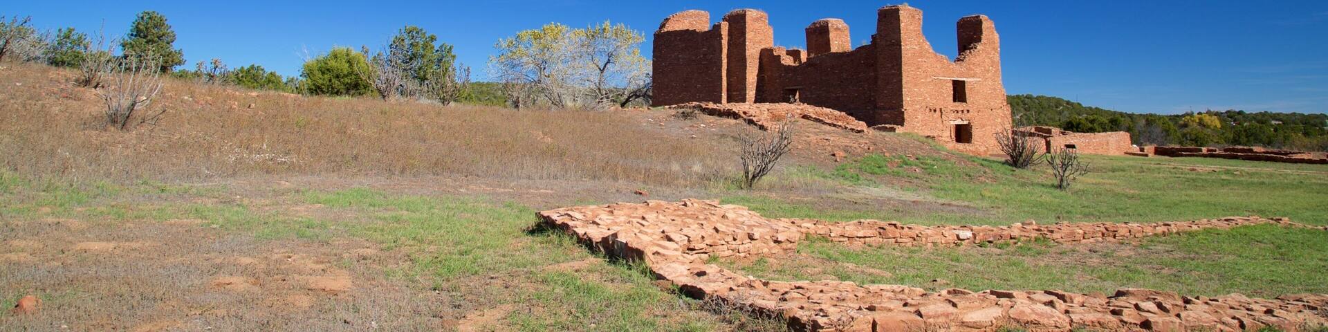 A historic adobe ruin with a clear blue sky.