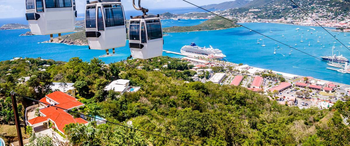 A cable car system, a coastal town, and a cruise ship.