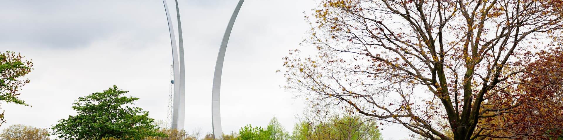Air Force Memorial in Arlington over military cemetery rows of tombstones