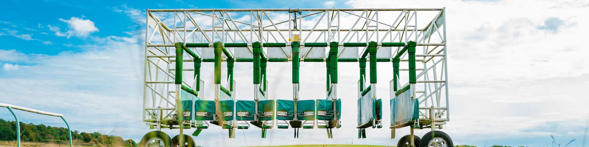 Ground level view on a race course of turnstiles used on a famous horse racing track in Newmarket, Suffolk, UK. Used to train horse and jockey of starting a race.