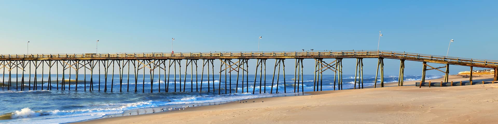 Ocean waves and fishing pier at Kure Beach, North Carolina
