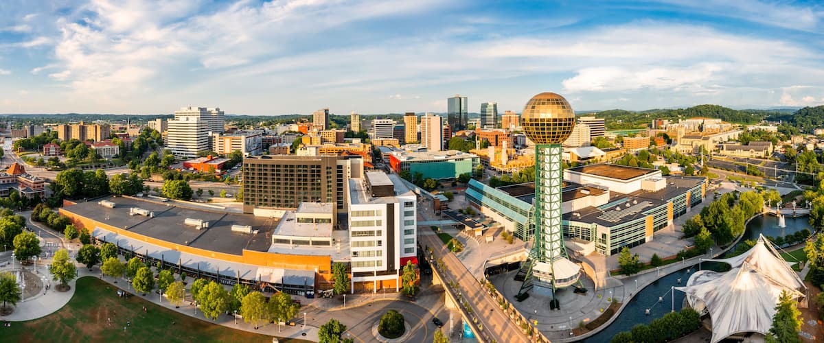 Aerial panorama of Knoxville, Tennessee skyline on a late sunny afternoon, viewed from above Worlds Fair Park. Knoxville is the county seat of Knox County in the U.S. state of Tennessee.