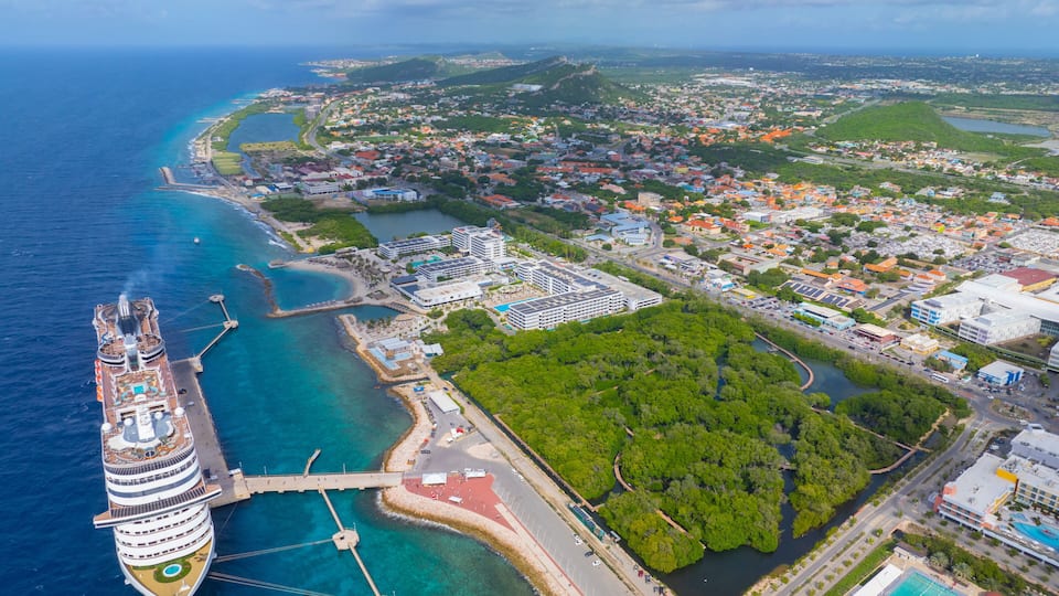 Otrobanda coast aerial view including Rif Mangrove Park and luxurious cruise ship docked at Cruise Terminal in Otrobanda, city of Willemstad, Curacao.