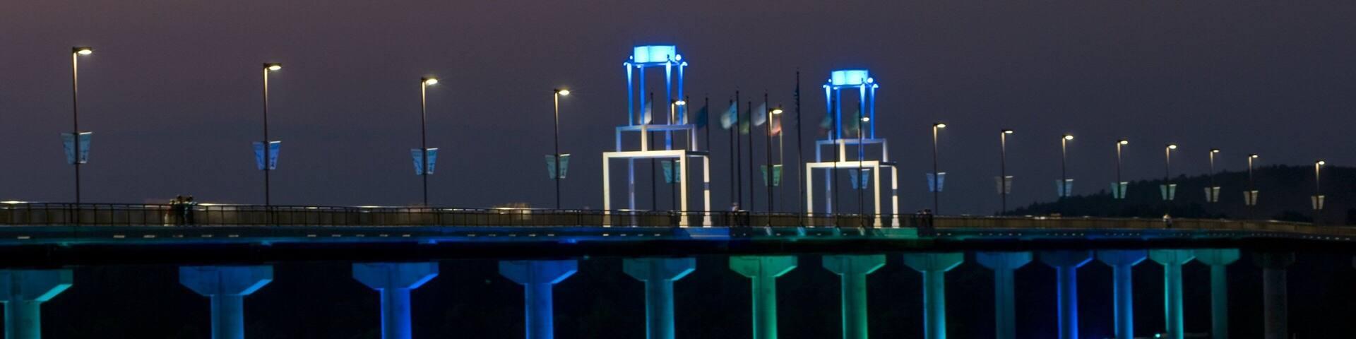 Big Dam Bridge featuring a bridge and night scenes