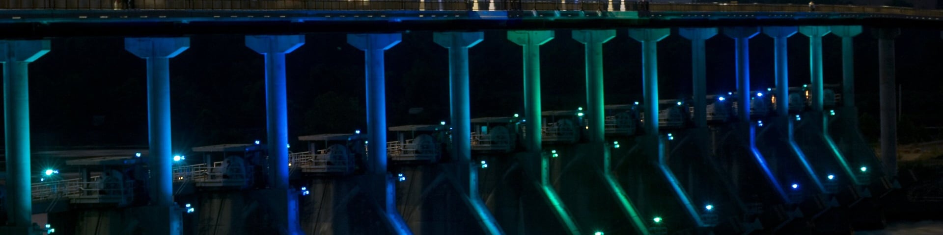 Big Dam Bridge featuring a bridge and night scenes