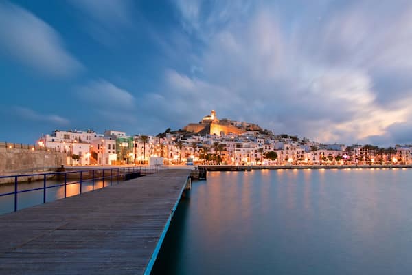 Ibiza Castle showing a sunset, a city and a bay or harbor