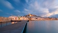 Ibiza Castle showing a sunset, a city and a bay or harbor