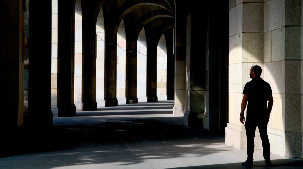 Reichsparteitagsgebaude featuring interior views as well as an individual male