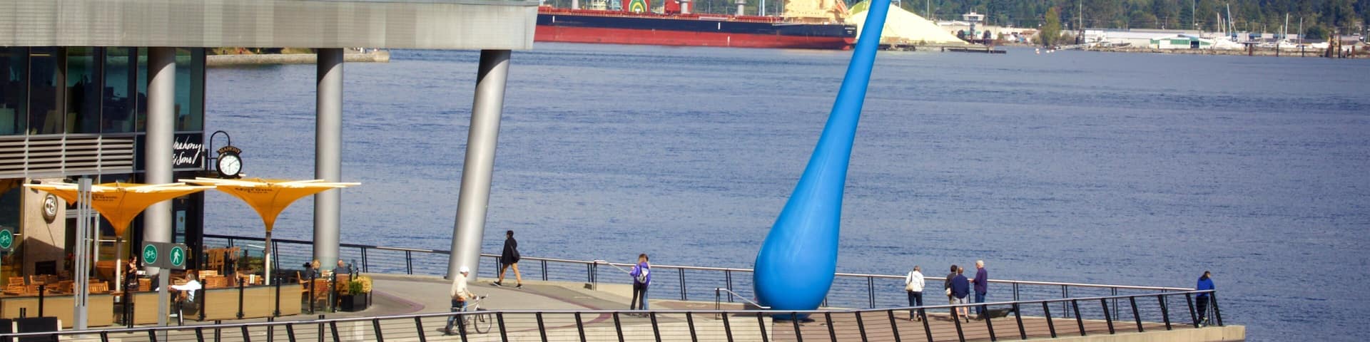 Vancouver Waterfront which includes a bay or harbor and outdoor art