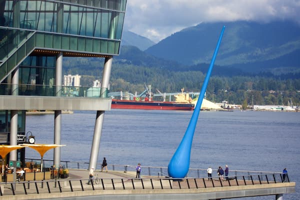 Vancouver Waterfront which includes a bay or harbor and outdoor art