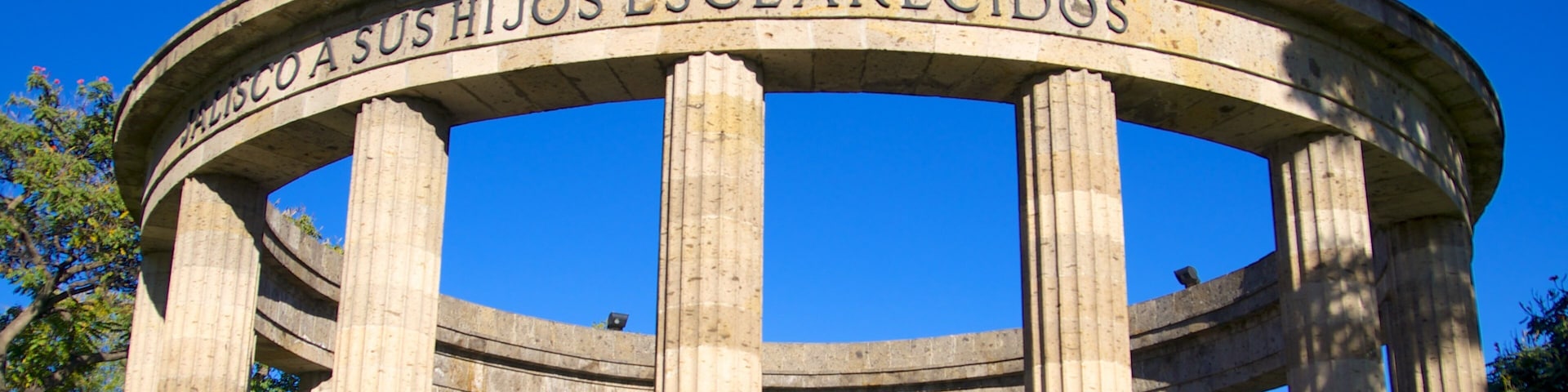 Rotonda de los Hombres Ilustres featuring a memorial and heritage architecture