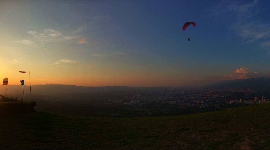 The hills above Bucaramanga in Colombia have near-perfect conditions for paragliding, making this a great place to take a tandem flight or to learn to paraglide solo. You can learn to fly solo in ten days and it is far cheaper than you would pay in Europe - the views are incredible & with Colombian tourism only just building momentum there are only a handful of other tourists doing it.