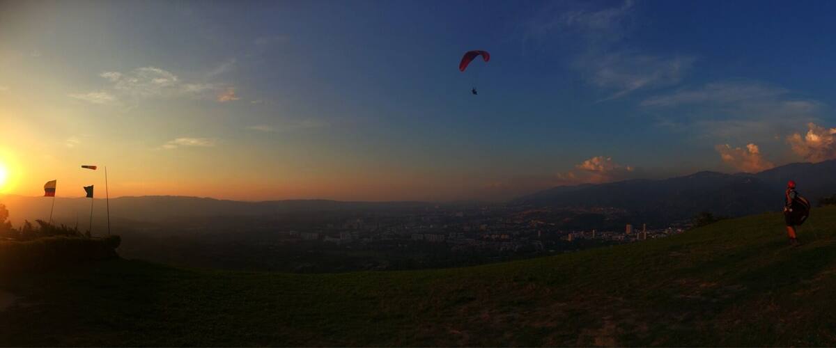 The hills above Bucaramanga in Colombia have near-perfect conditions for paragliding, making this a great place to take a tandem flight or to learn to paraglide solo. You can learn to fly solo in ten days and it is far cheaper than you would pay in Europe - the views are incredible & with Colombian tourism only just building momentum there are only a handful of other tourists doing it.