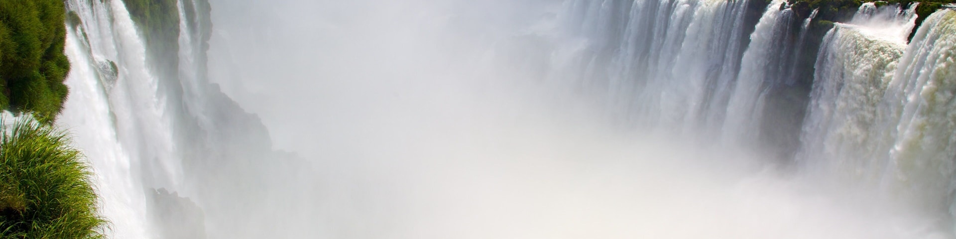 Devil\'s Throat featuring a cascade, mist or fog and landscape views