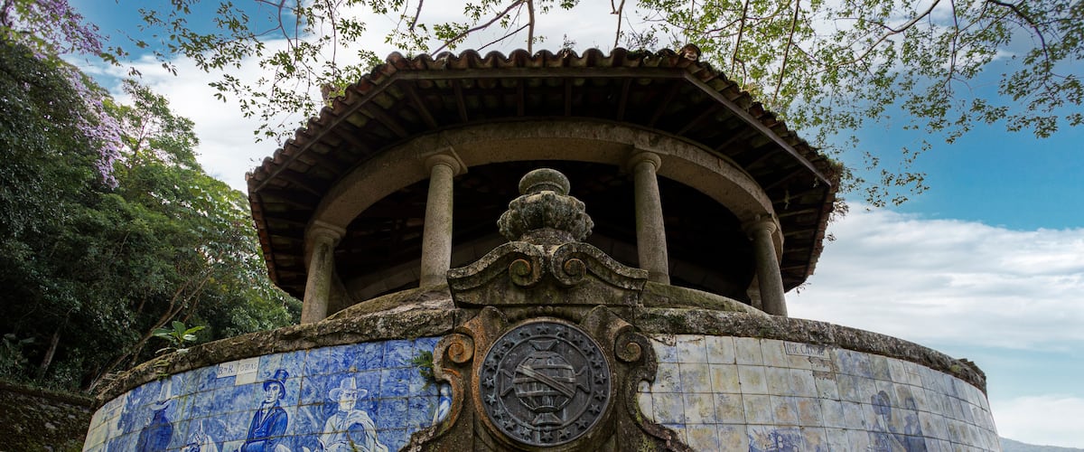 A historical building with a tiled facade and a dome structure.